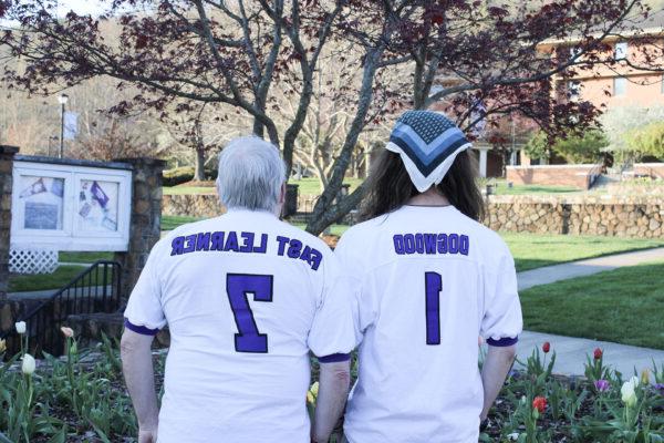 a couple of people wearing sports uniforms